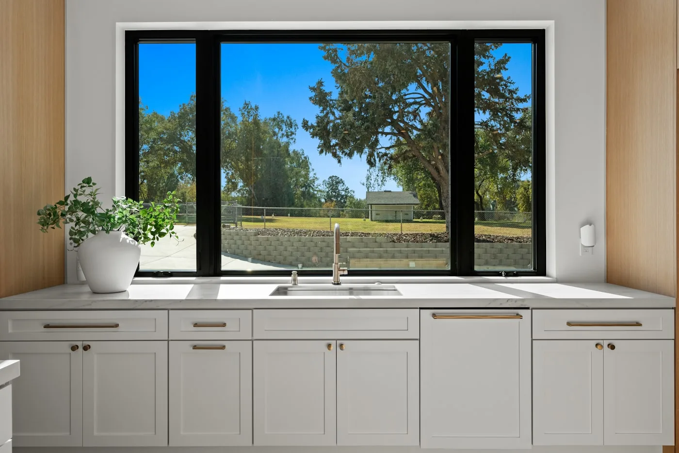 A kitchen window over the sink, measured before any film is ordered